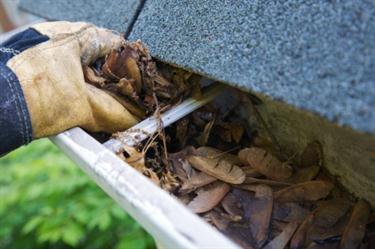 Cleaning gutter in Cliffwood Beach, NJ.